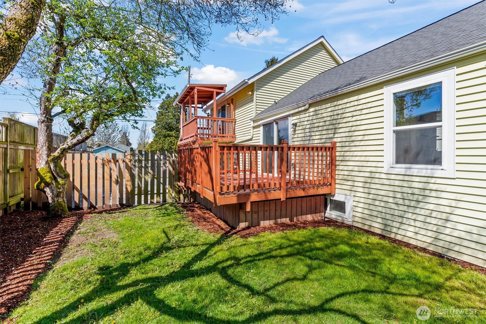 8109 15th Avenue Southwest Seattle, WA 98106 - Photo 11 of 39 a view of backyard with a garden and deck
