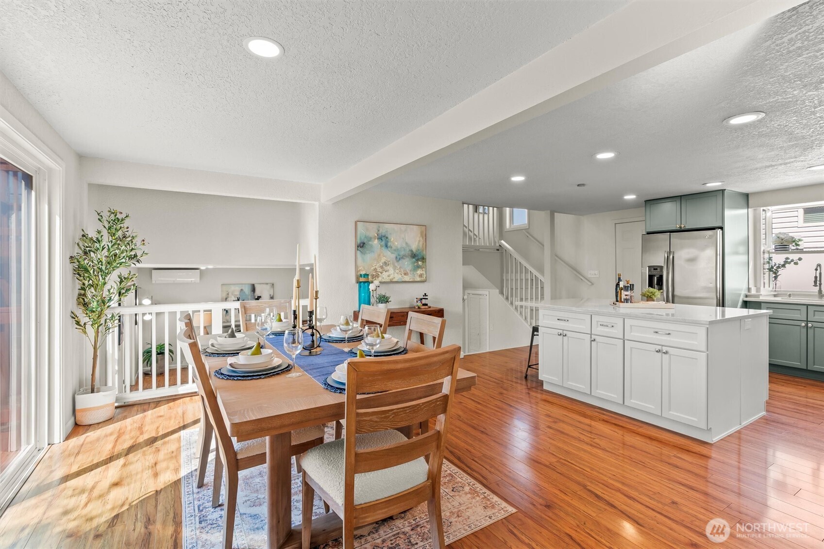 8109 15th Avenue Southwest Seattle, WA 98106 - Photo 12 of 39 a dining hall with stainless steel appliances kitchen island granite countertop a dining table chairs and view living room