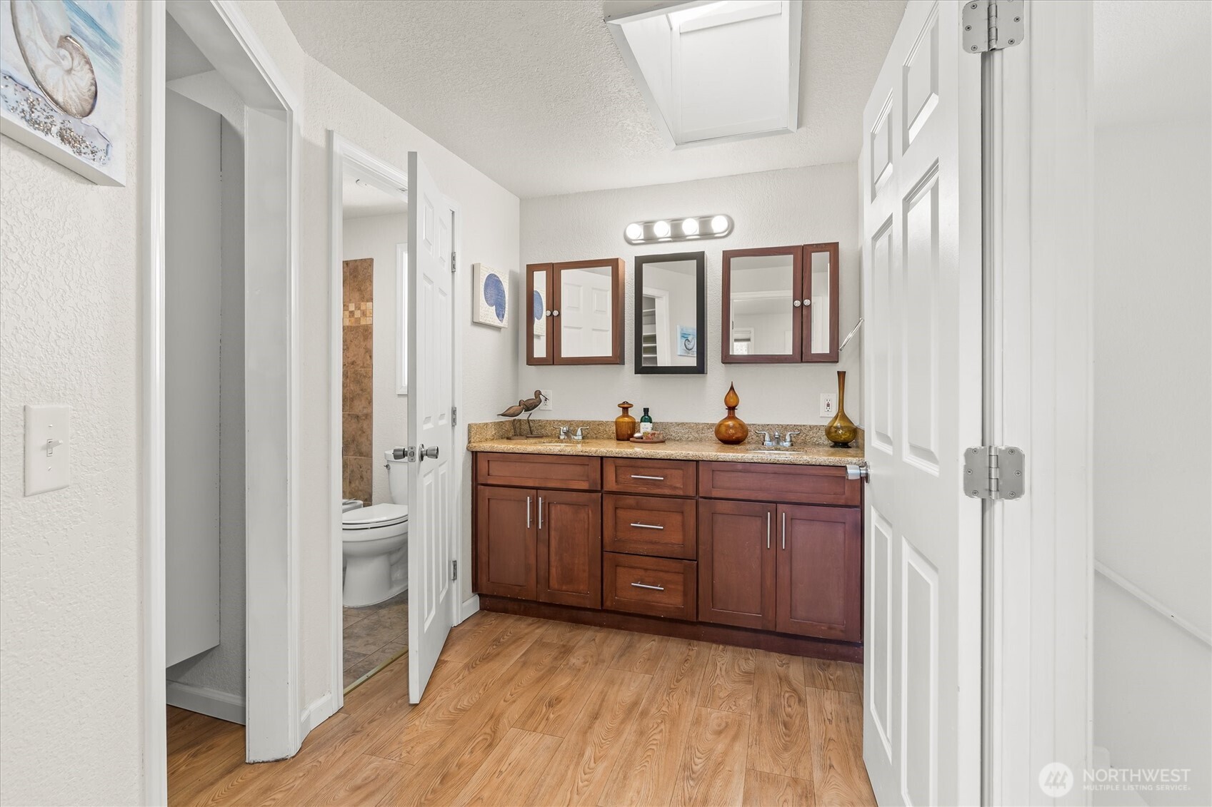 8109 15th Avenue Southwest Seattle, WA 98106 - Photo 16 of 39 a bathroom with a granite countertop sink mirror and toilet