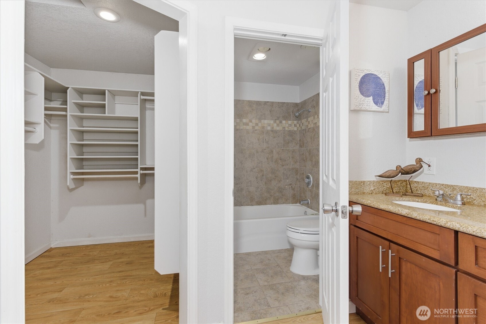 8109 15th Avenue Southwest Seattle, WA 98106 - Photo 18 of 39 a bathroom with a granite countertop sink toilet and shower
