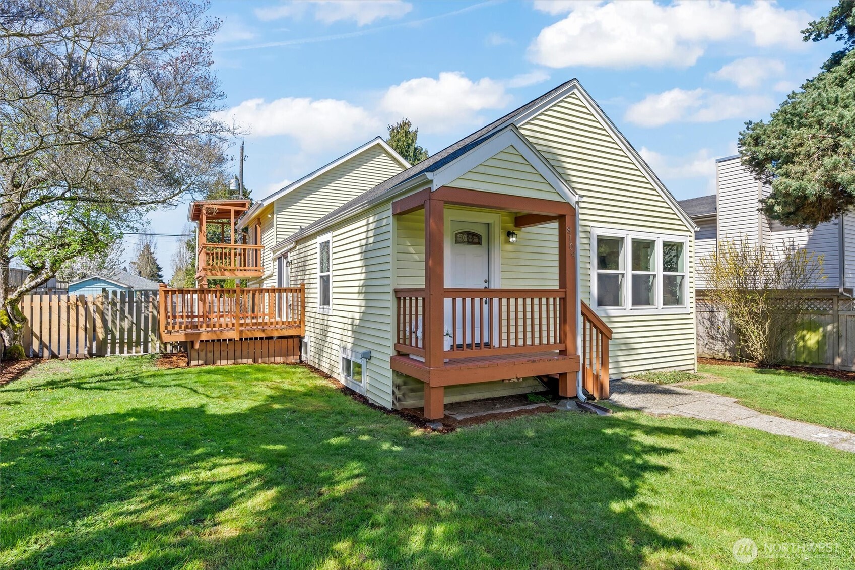 8109 15th Avenue Southwest Seattle, WA 98106 - Photo 2 of 39 a view of a house with a yard and deck