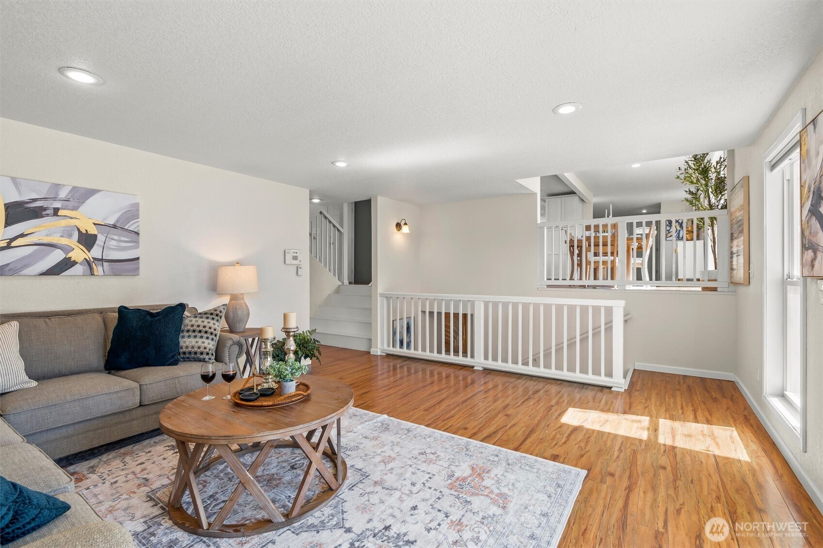8109 15th Avenue Southwest Seattle, WA 98106 - Photo 22 of 39 a living room with furniture and a wooden floor