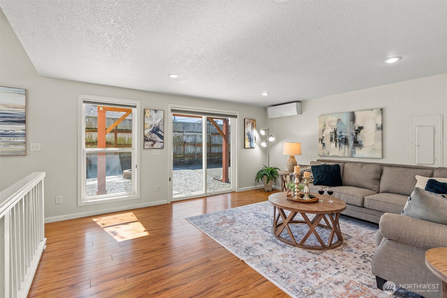 8109 15th Avenue Southwest Seattle, WA 98106 - Photo 23 of 39 a living room with furniture and wooden floor