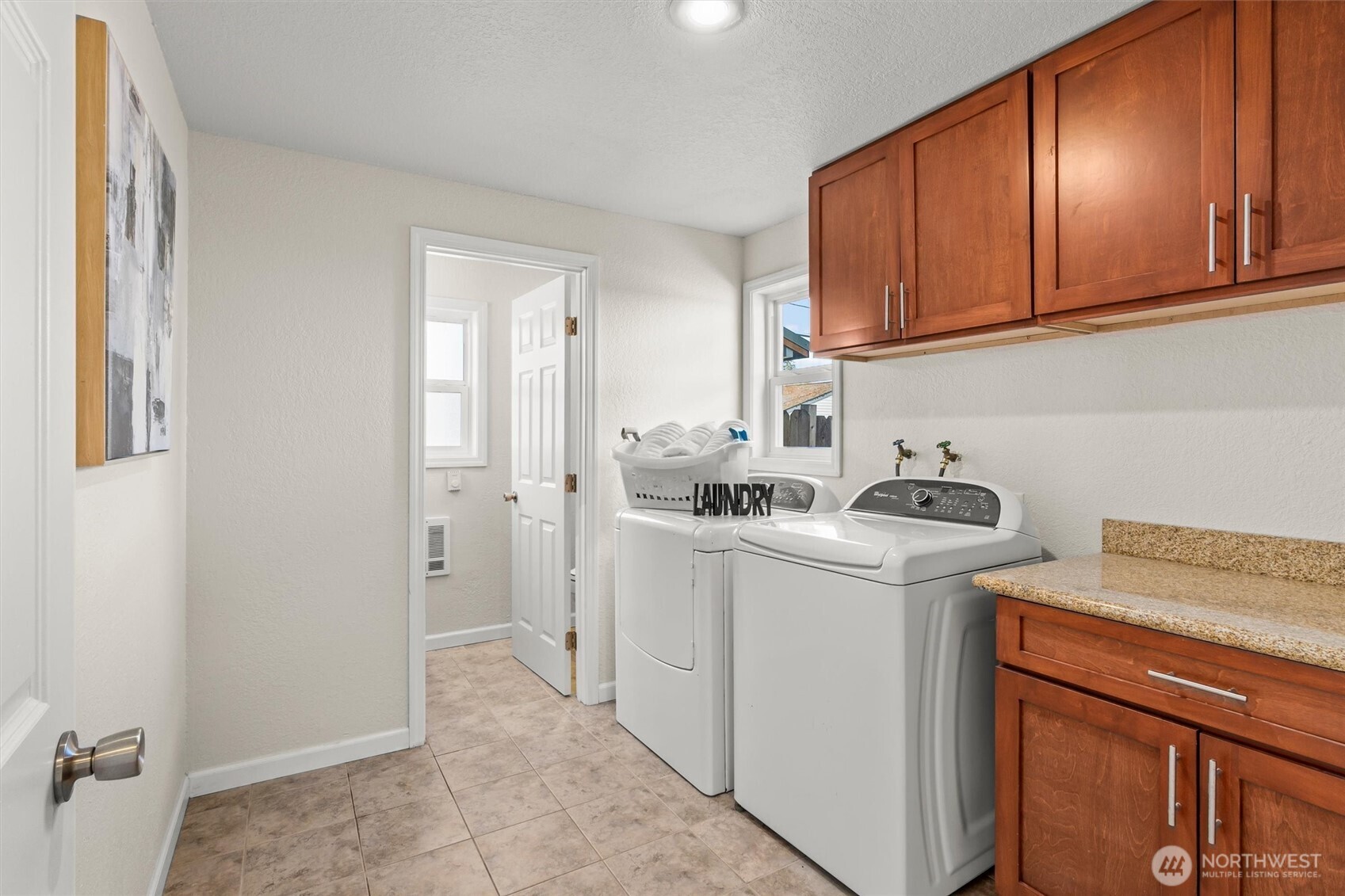 8109 15th Avenue Southwest Seattle, WA 98106 - Photo 24 of 39 a view of a kitchen with sink and cabinets