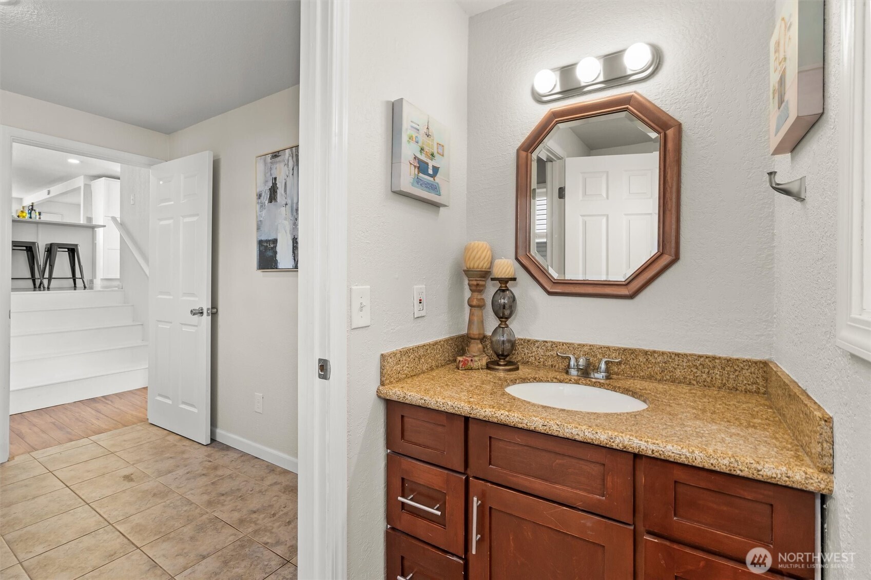 8109 15th Avenue Southwest Seattle, WA 98106 - Photo 25 of 39 a bathroom with a sink vanity and a mirror