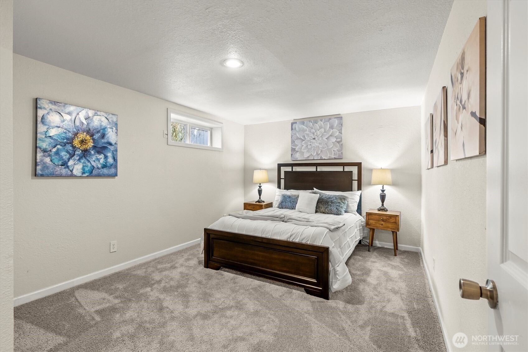 8109 15th Avenue Southwest Seattle, WA 98106 - Photo 28 of 39 a spacious bedroom with a bed and a cabinets
