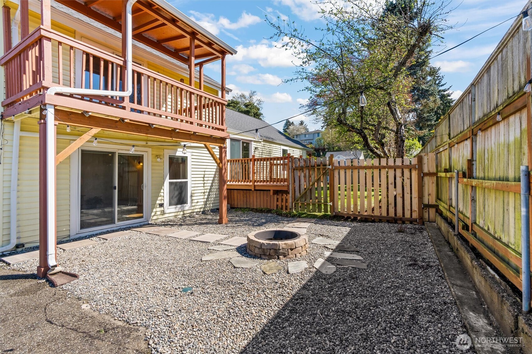8109 15th Avenue Southwest Seattle, WA 98106 - Photo 34 of 39 a backyard of a house with wooden fence