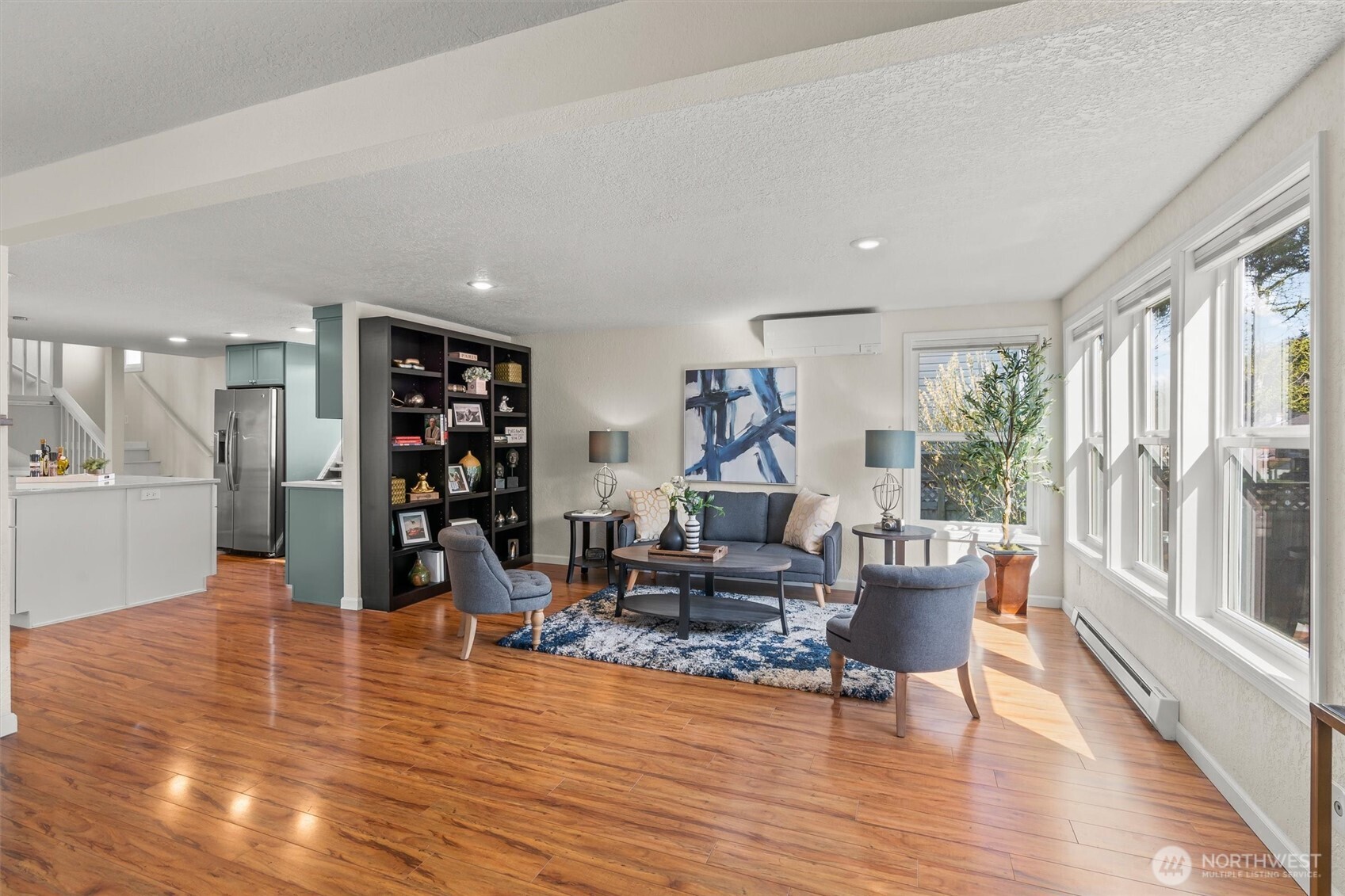 8109 15th Avenue Southwest Seattle, WA 98106 - Photo 5 of 39 a living room with furniture and a wooden floor