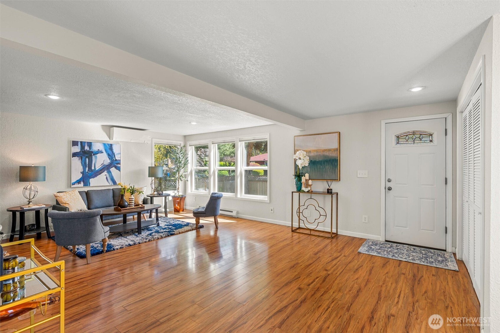 8109 15th Avenue Southwest Seattle, WA 98106 - Photo 6 of 39 a living room with furniture and a wooden floor