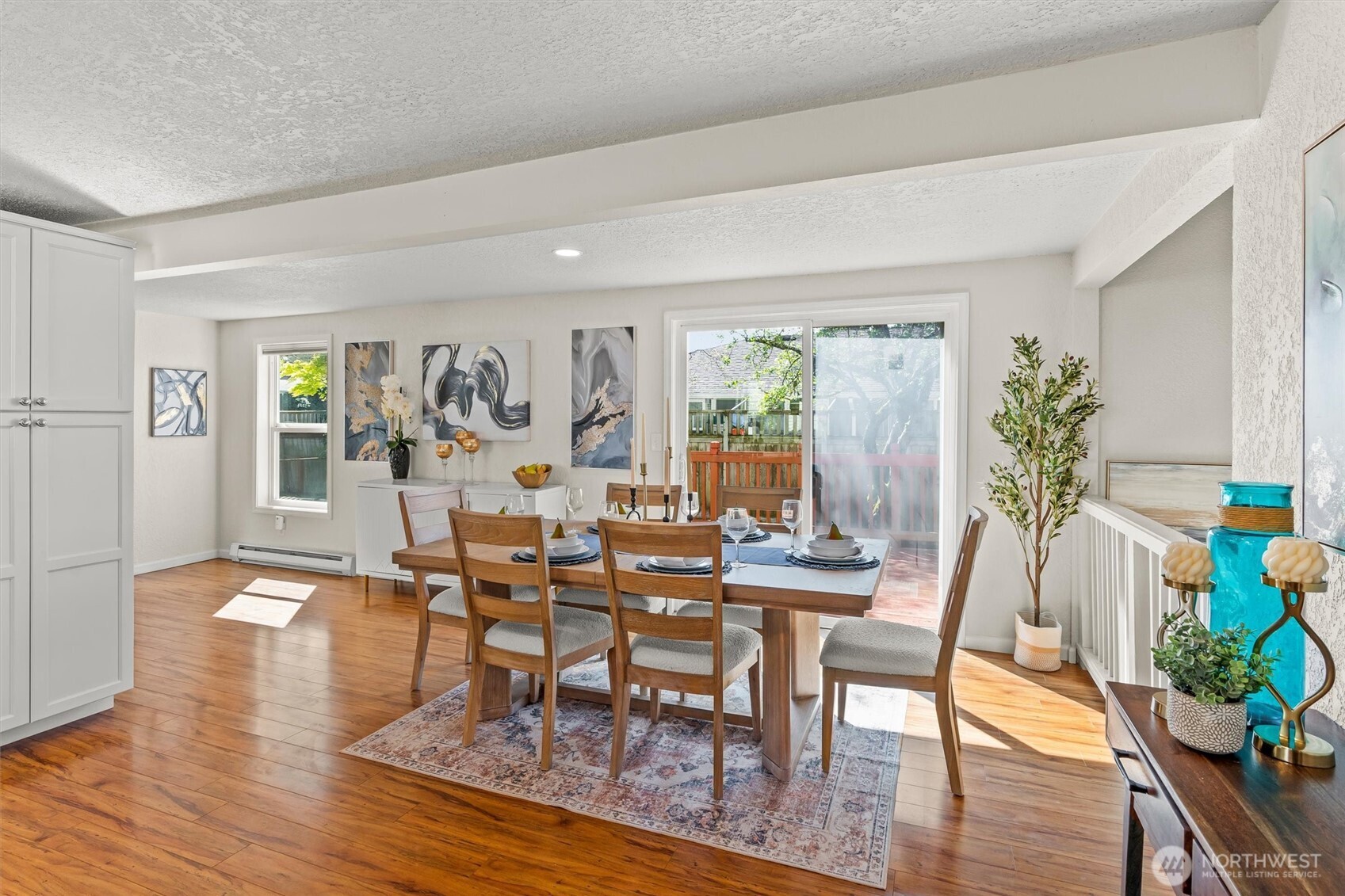 8109 15th Avenue Southwest Seattle, WA 98106 - Photo 9 of 39 a view of a dining room with furniture window and wooden floor