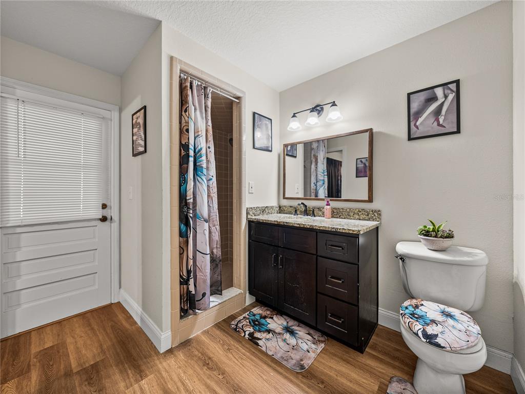 609 West Pipkin Road Lakeland, FL 33813 - Photo 40 of 72 a bathroom with a sink mirror and toilet