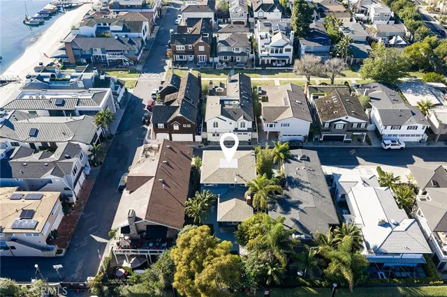an aerial view of a houses with yard