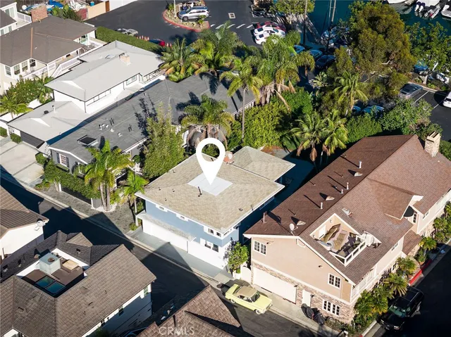 an aerial view of a residential apartment building with a yard