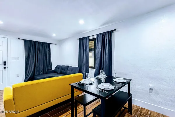 a view of a room with furniture and window