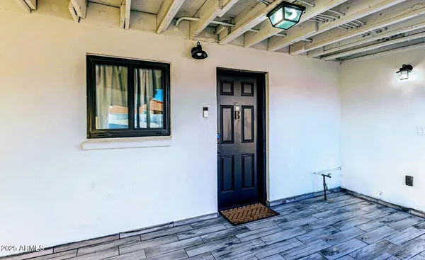 a view of entryway with wooden floor