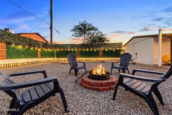a view of a chairs and tables in the patio