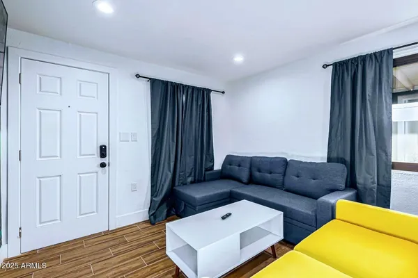 a living room with furniture and a window