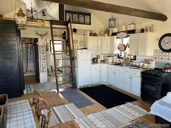 a kitchen with a sink appliances and cabinets
