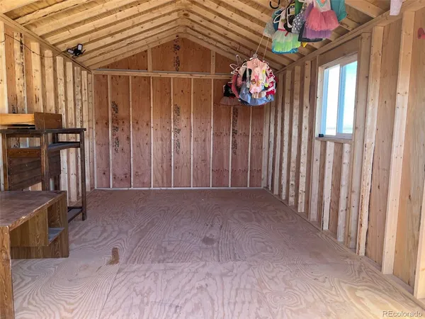 a view of entryway with a front door and wooden floor