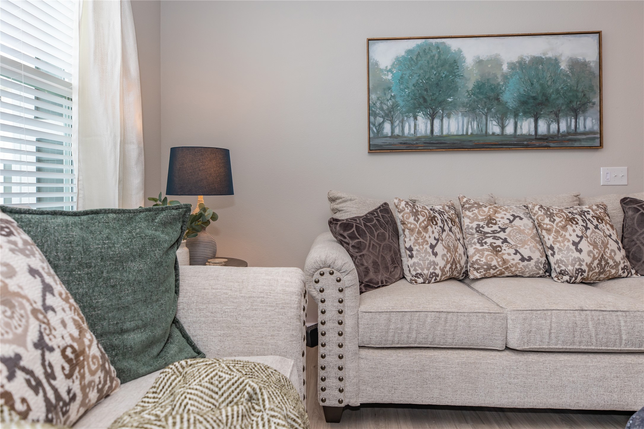 14809 Ralston Road, Unit A18302 Humble, TX 77396 - Photo 9 of 16 a living room with furniture and a painting on the wall