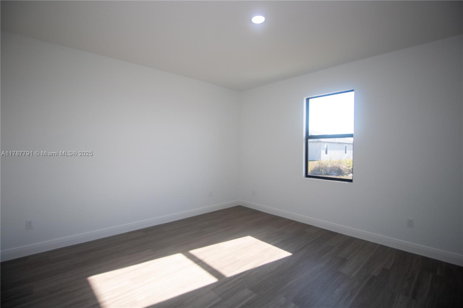 9023 Meadow Circle LaBelle, FL 33935 - Photo 25 of 35 an empty room with a window