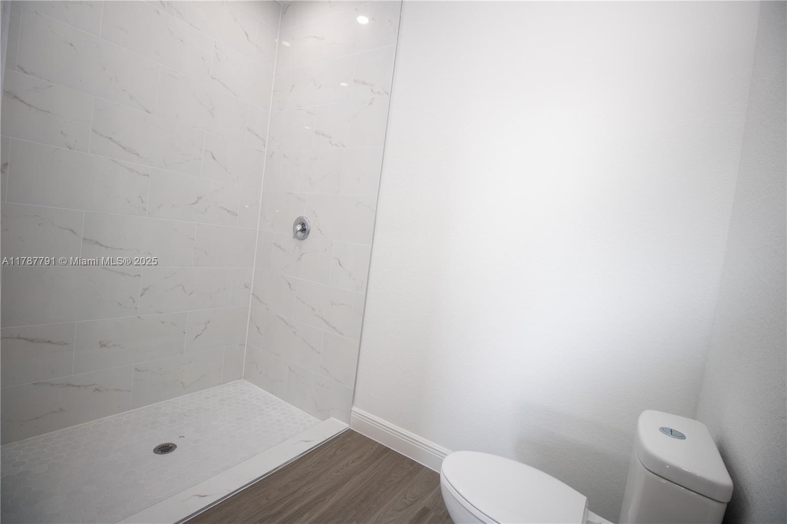 9023 Meadow Circle LaBelle, FL 33935 - Photo 28 of 35 a bathroom with a toilet and shower