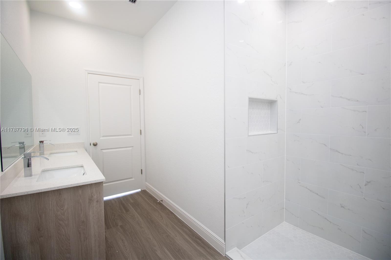 9023 Meadow Circle LaBelle, FL 33935 - Photo 30 of 35 a bathroom with a sink and a mirror