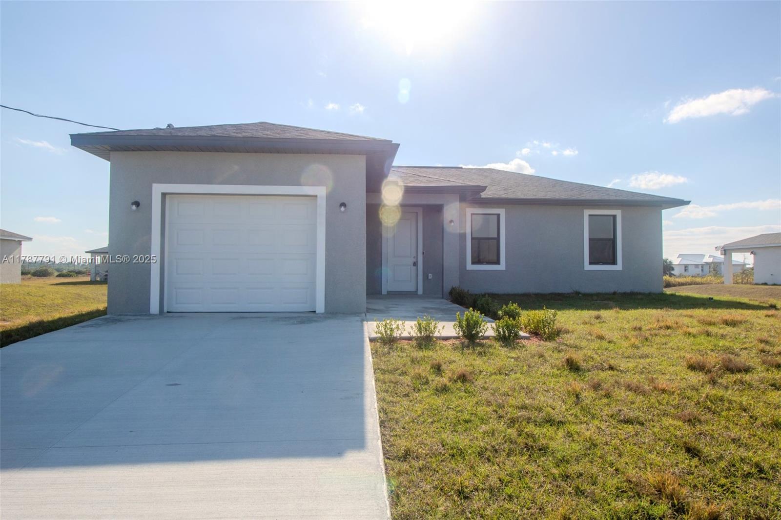 9023 Meadow Circle LaBelle, FL 33935 - Photo 3 of 35 a view of an empty room with cabinet