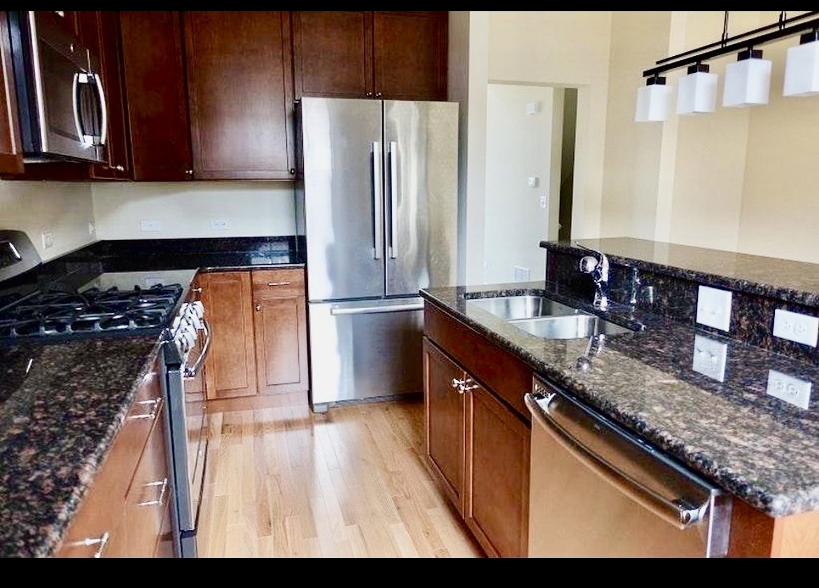2018 Shermer Road, Unit 2018 Glenview, IL 60026 - Photo 8 of 39 a kitchen with stainless steel appliances granite countertop a sink stove and refrigerator