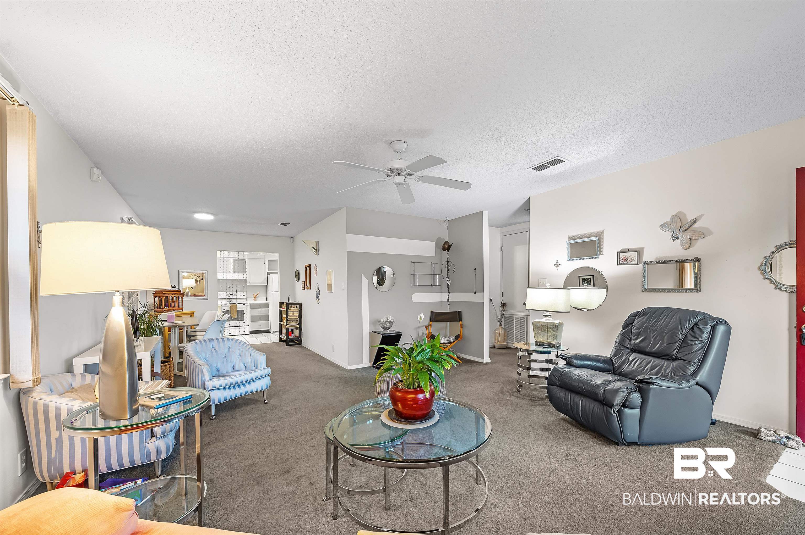 526 Ariel Avenue Foley, AL 36535 - Photo 9 of 33 Carpeted living room with a textured ceiling and ceiling fan