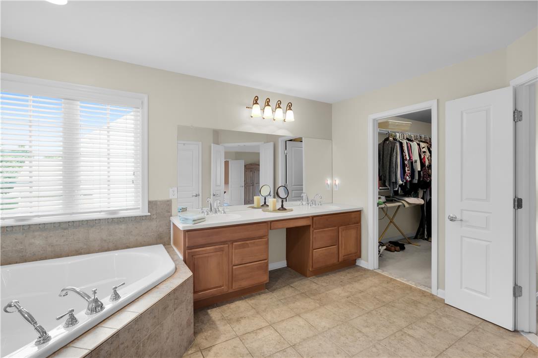 1709 Travers Road Breinigsville, PA 18031 - Photo 32 of 55 Double vanity and a deep soaking tub create a personal spa retreat.