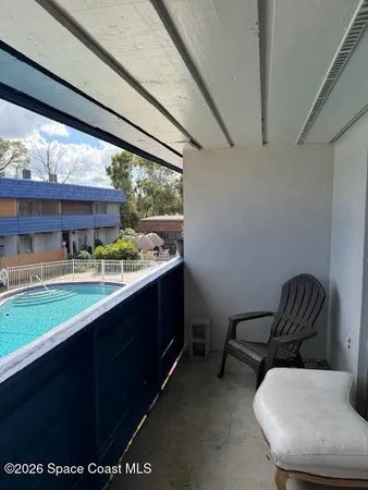 a room with furniture and a large window