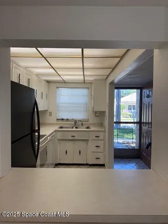 a kitchen with stainless steel appliances a refrigerator and a stove