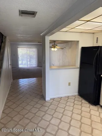 a view of an empty room and window