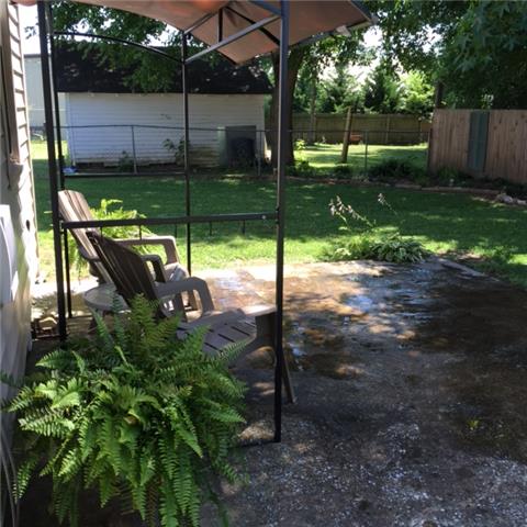 302 Madison Street Manchester, TN 37355 - Photo 3 of 14 Enjoy patio outdoor living, privacy new fencing across back.
