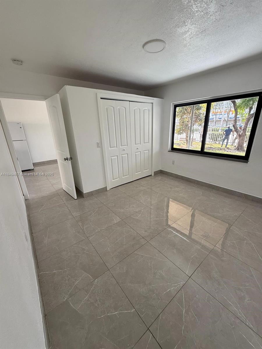 351 East 4th Avenue, Unit 4 Hialeah, FL 33010 - Photo 17 of 19 a view of an empty room with a window