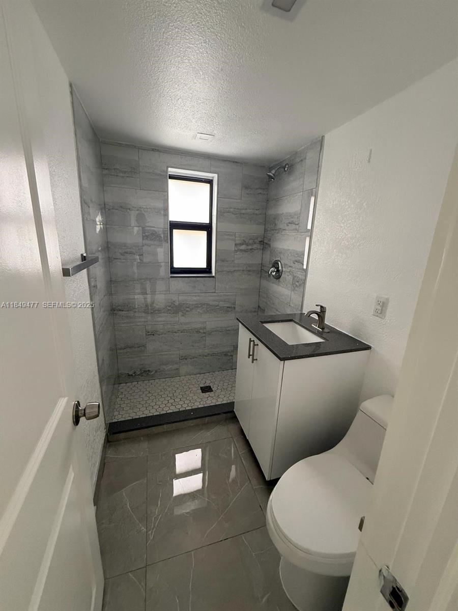 351 East 4th Avenue, Unit 4 Hialeah, FL 33010 - Photo 7 of 19 a bathroom with a toilet and a shower