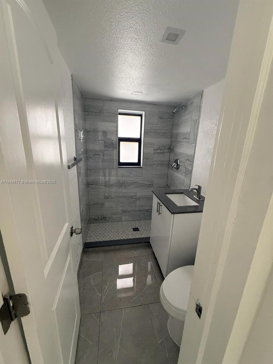 351 East 4th Avenue, Unit 4 Hialeah, FL 33010 - Photo 8 of 19 a bathroom with a toilet and a shower