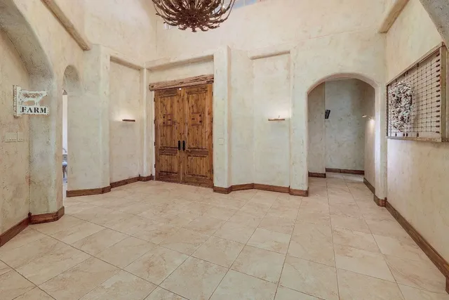 a bathroom with a bathtub and window