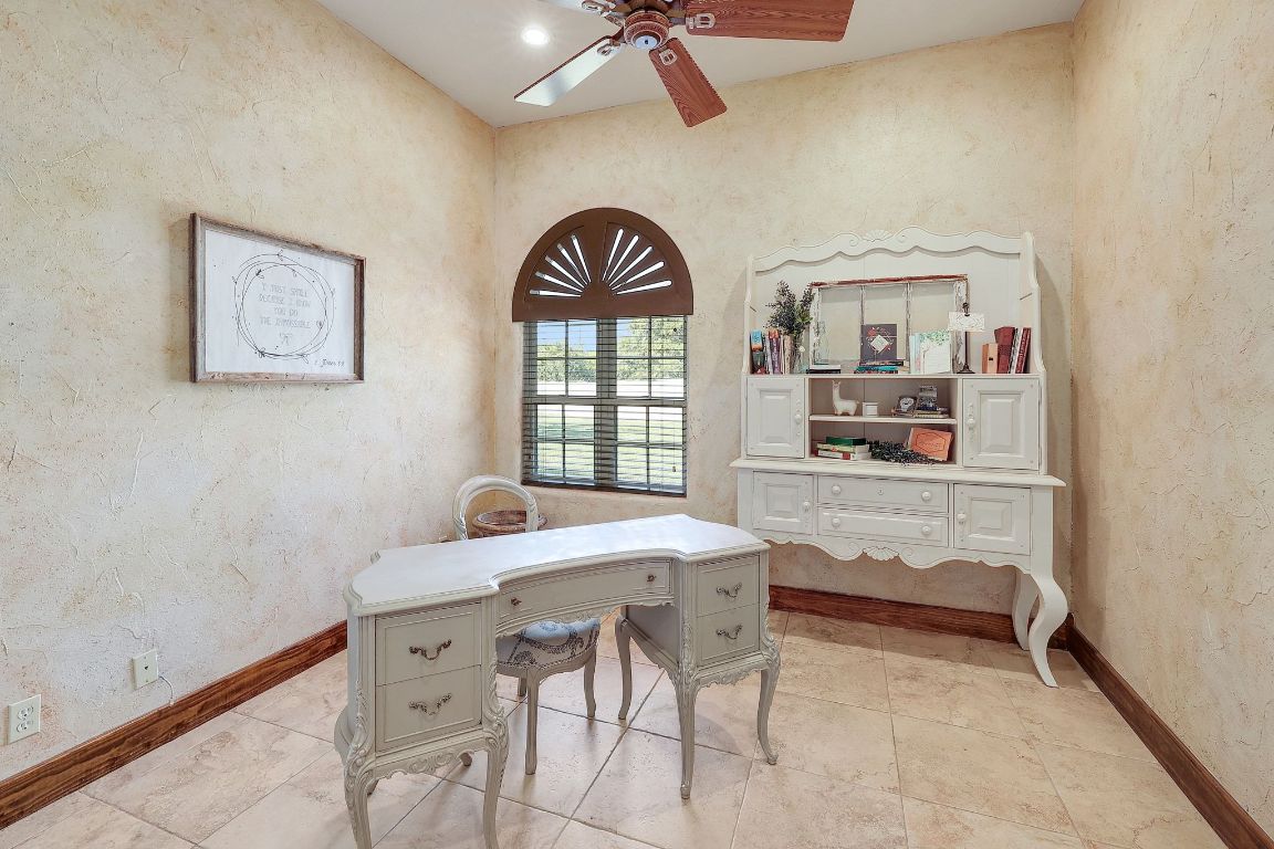 1120 Redbird Road Granger, TX 76530 - Photo 24 of 40 a view of a workspace room with furniture and window
