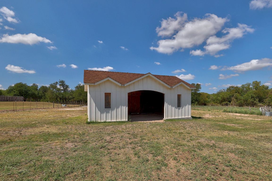 1120 Redbird Road Granger, TX 76530 - Photo 36 of 40 a view of a house with a backyard