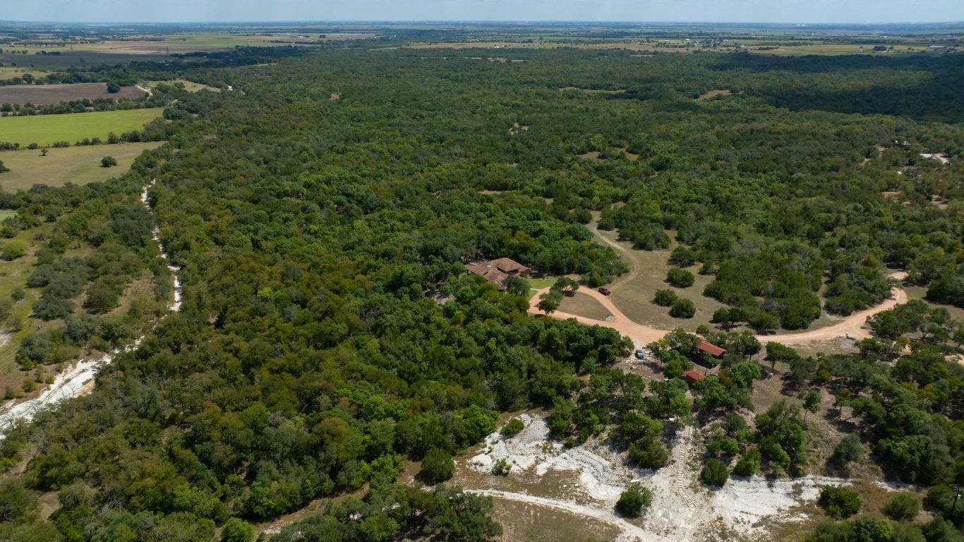 1120 Redbird Road Granger, TX 76530 - Photo 5 of 40 Aerial view of property's location with a forest