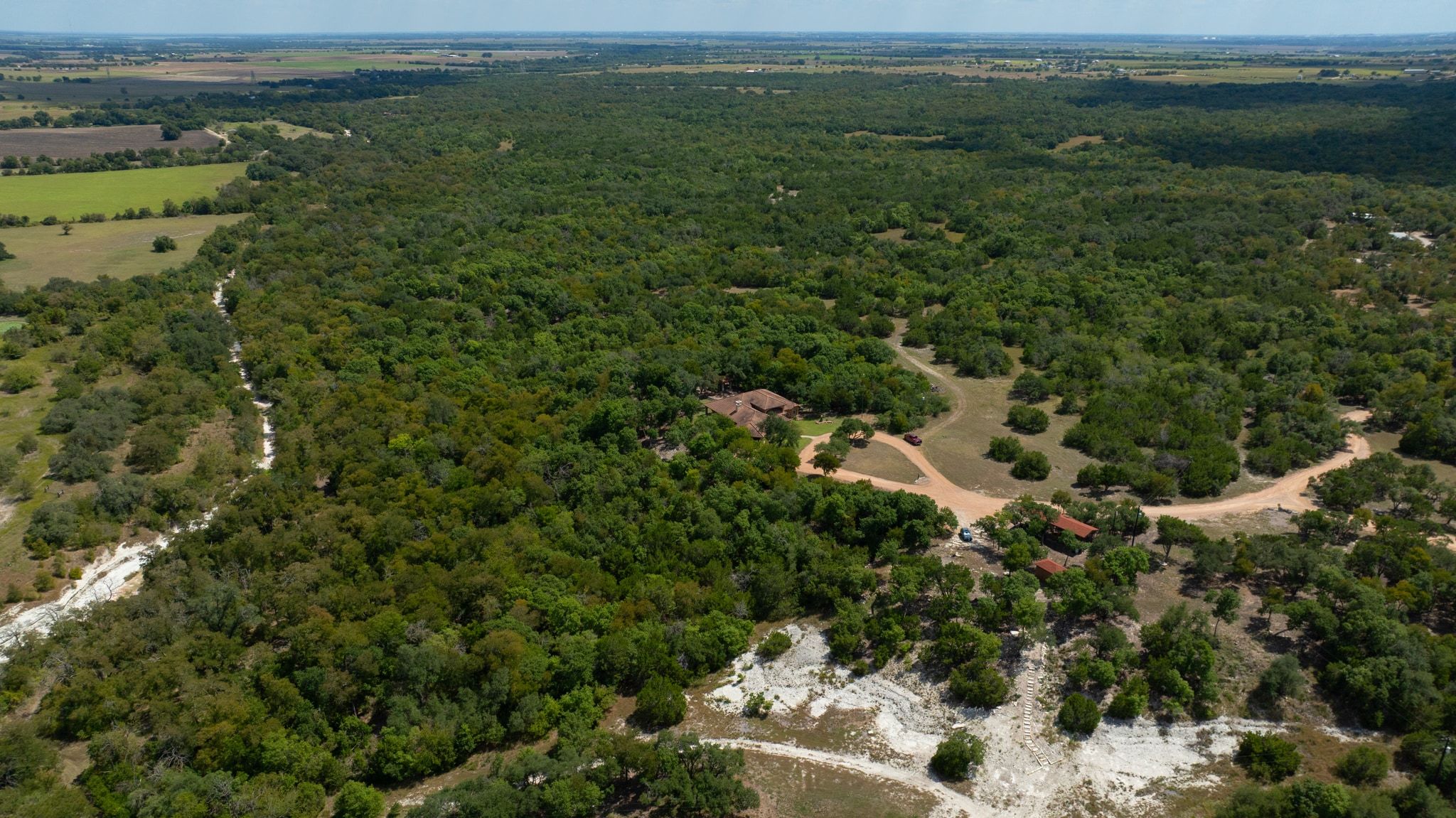 1120 Redbird Road Granger, TX 76530 - Photo 5 of 40 an aerial view of a houses with outdoor space and trees