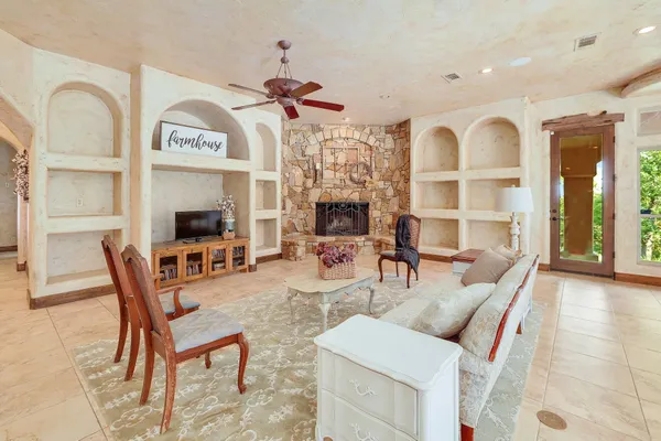 a view of a livingroom with furniture and a fireplace