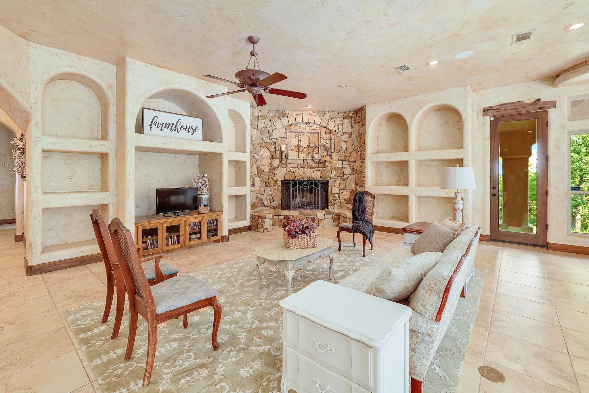 1120 Redbird Road Granger, TX 76530 - Photo 7 of 40 a view of a livingroom with furniture and a fireplace