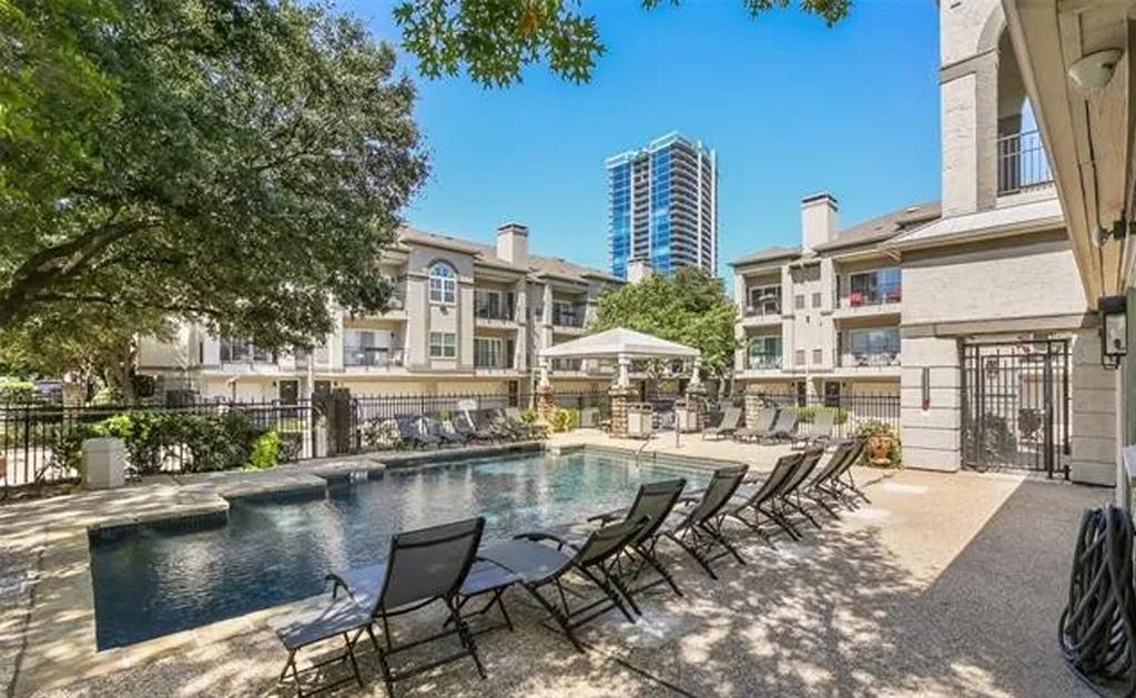 2201 Wolf Street, Unit 6104 Dallas, TX 75201 - Photo 11 of 11 a view of a lake with outdoor seating