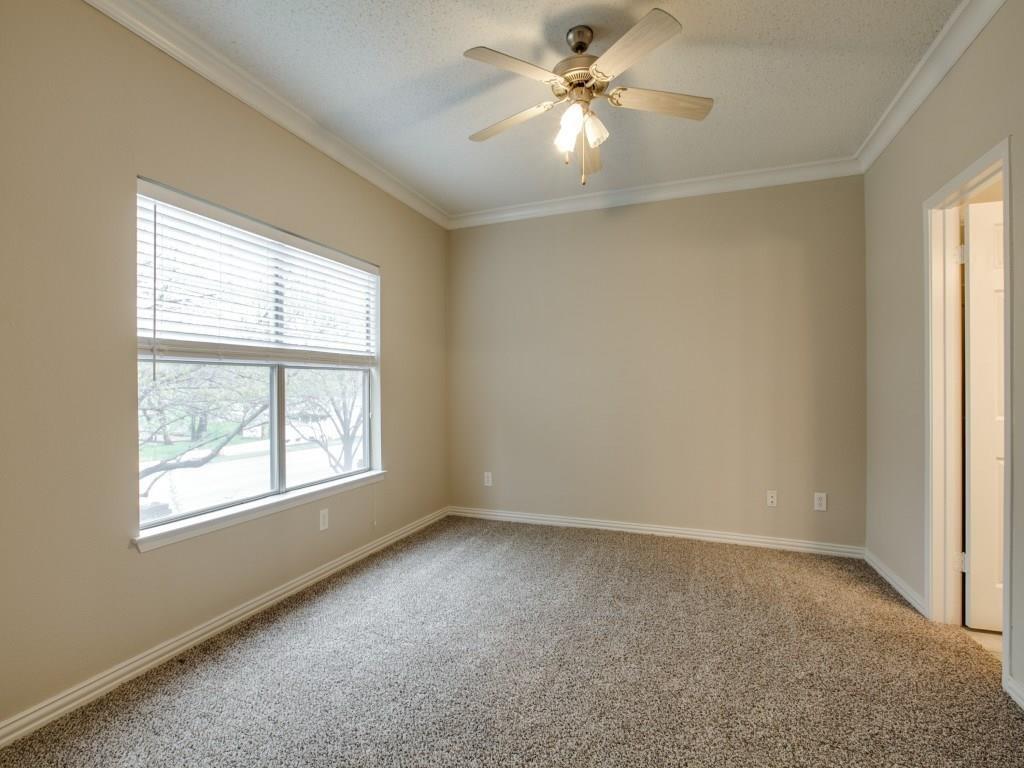 2201 Wolf Street, Unit 6104 Dallas, TX 75201 - Photo 5 of 11 an empty room with a window and a fan