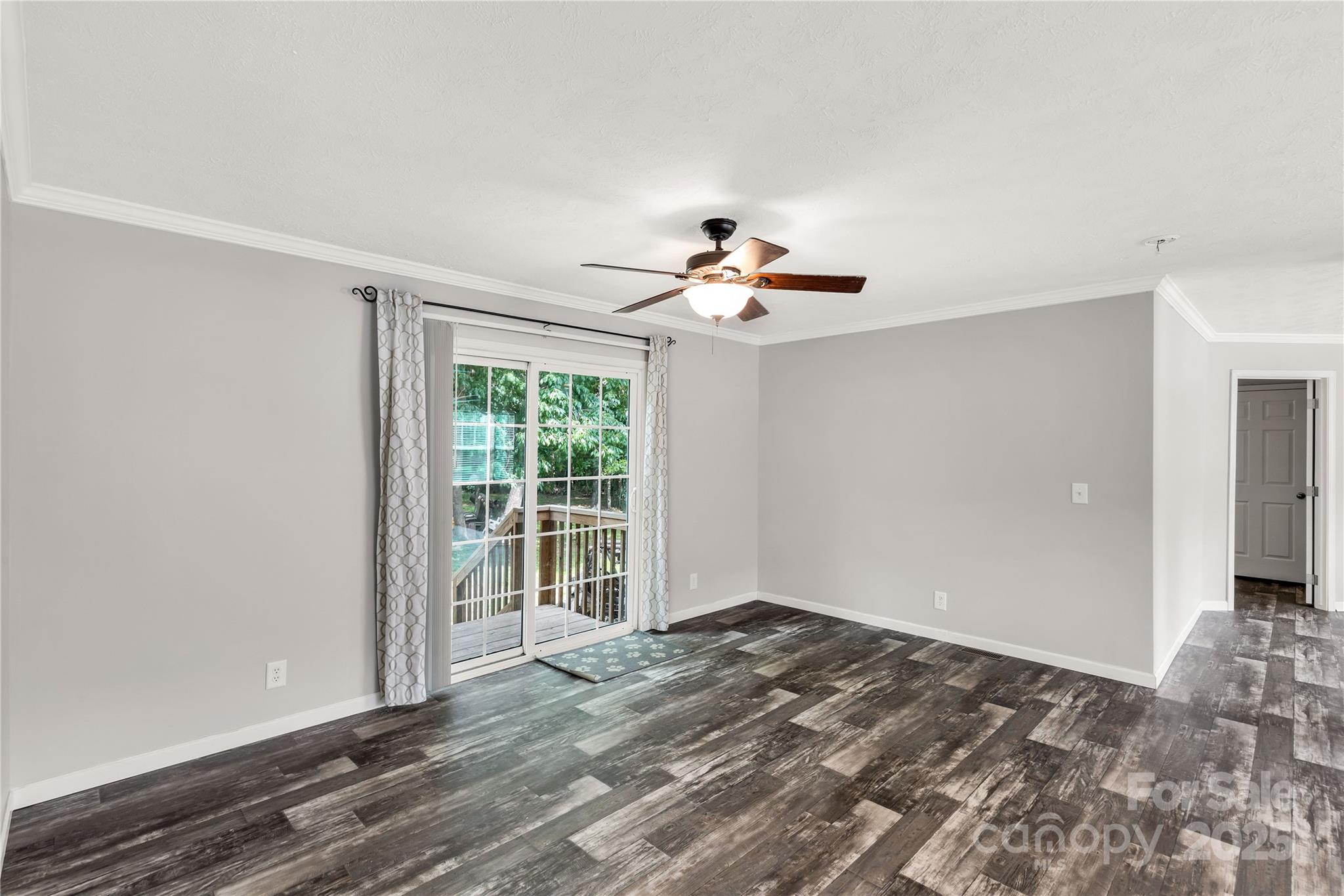159 Blackmon Road Lancaster, SC 29720 - Photo 11 of 32 a view of empty room with wooden floor and fan