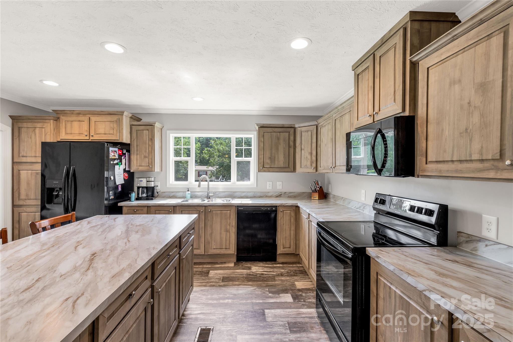 159 Blackmon Road Lancaster, SC 29720 - Photo 12 of 32 a kitchen with stainless steel appliances granite countertop a sink stove and refrigerator