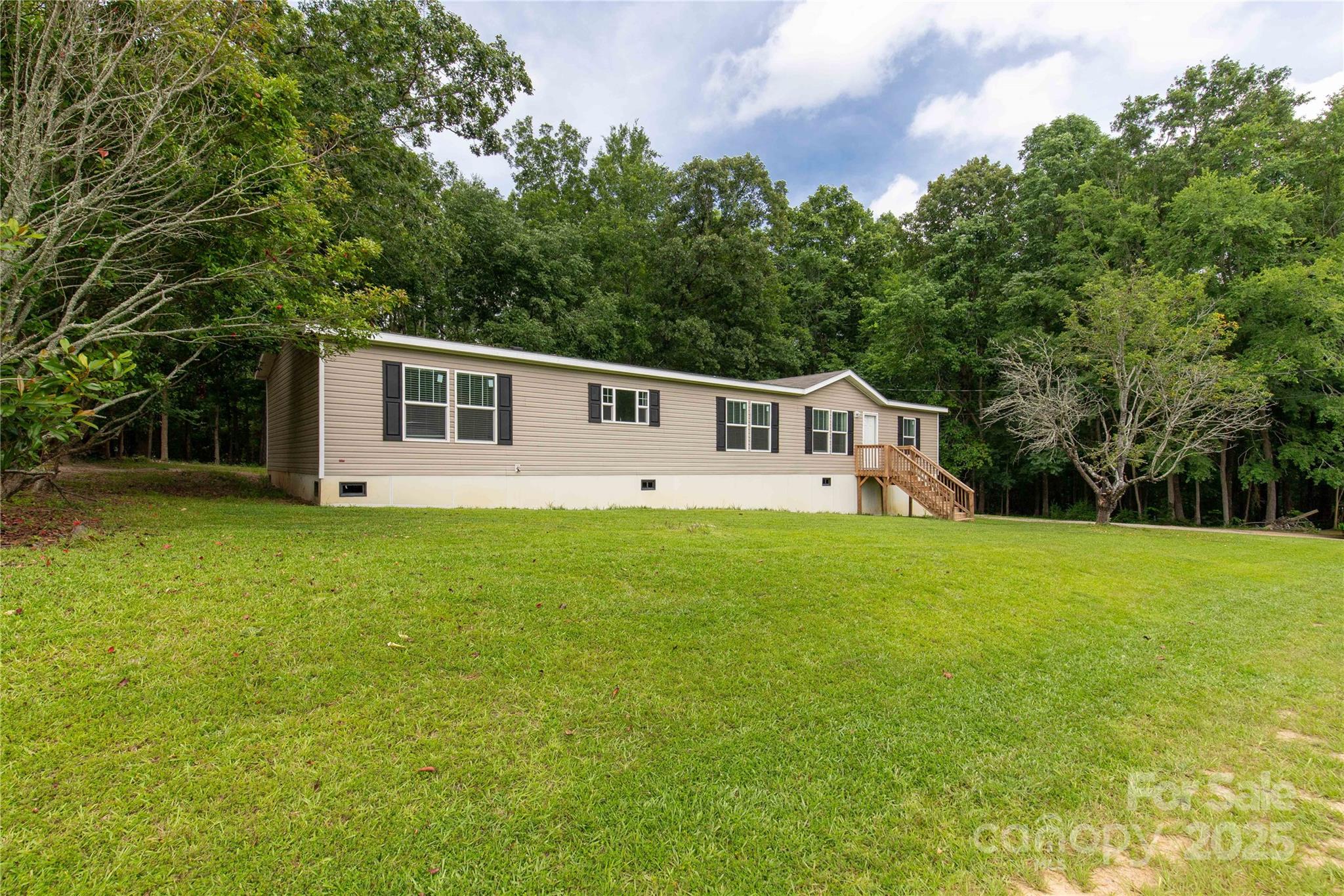 159 Blackmon Road Lancaster, SC 29720 - Photo 2 of 32 a view of a house with backyard and garden